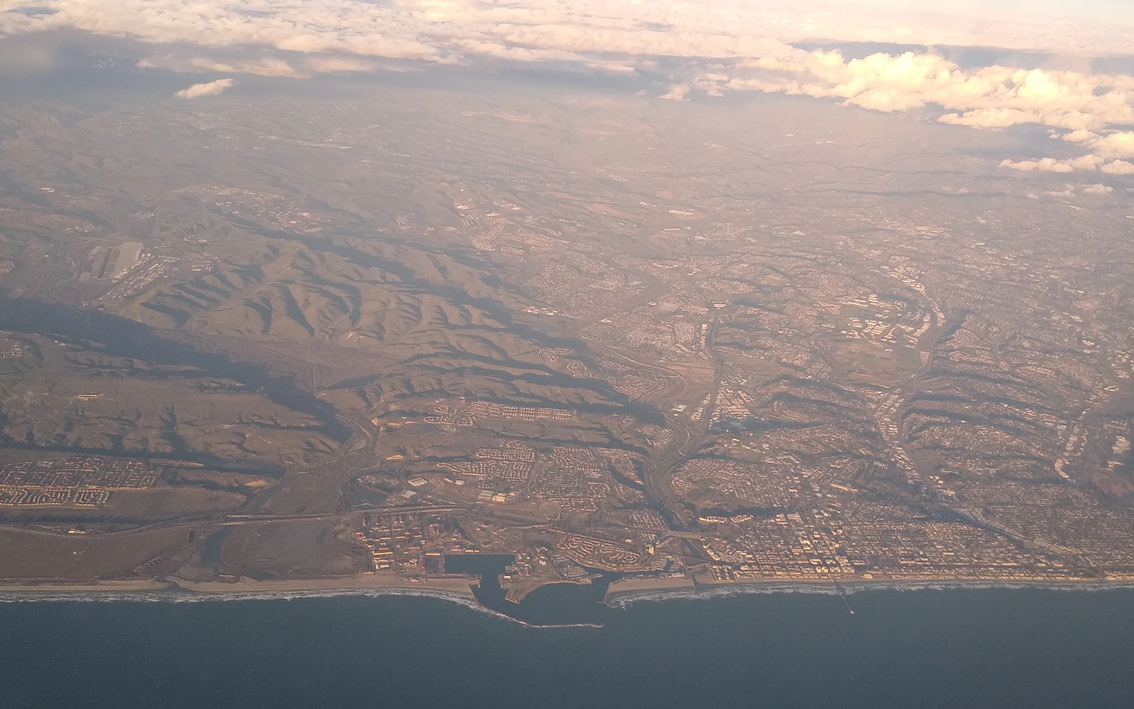 High-altitude view of the Camp Pendleton coastline and boat basin meeting the northern edge of Oceanside
